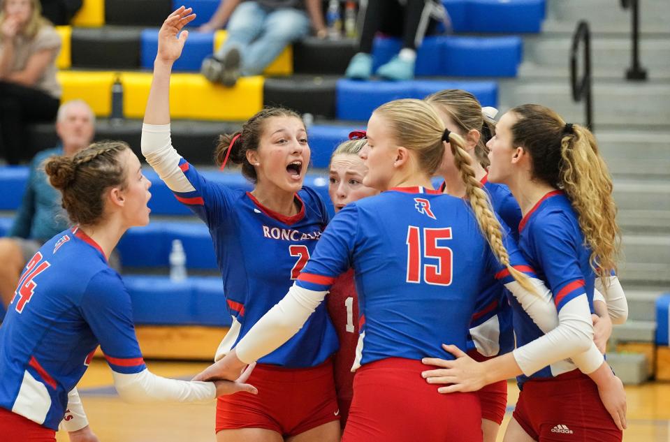 Roncalli Royals outside hitter Logan Bell (2) yells in excitement with teammates Saturday, Oct. 21, 2023, during the IHSAA Class 3A sectional semifinal at Greenfield-Central High School in Greenfield. The Roncalli Royals defeated the Avon Orioles in three sets.
