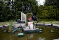 FILE - In this June 9, 2020 file photo, the bust of Belgium's King Leopold II is smeared with paint and graffiti on the grounds of the Royal Museum for Central Africa in Tervuren, Belgium. With the protests sweeping the world in the wake of the killing of George Floyd in Minneapolis, King Leopold II, who reigned from 1865 to 1909, is now increasingly seen as a stain on the nation. (AP Photo/Virginia Mayo, File)