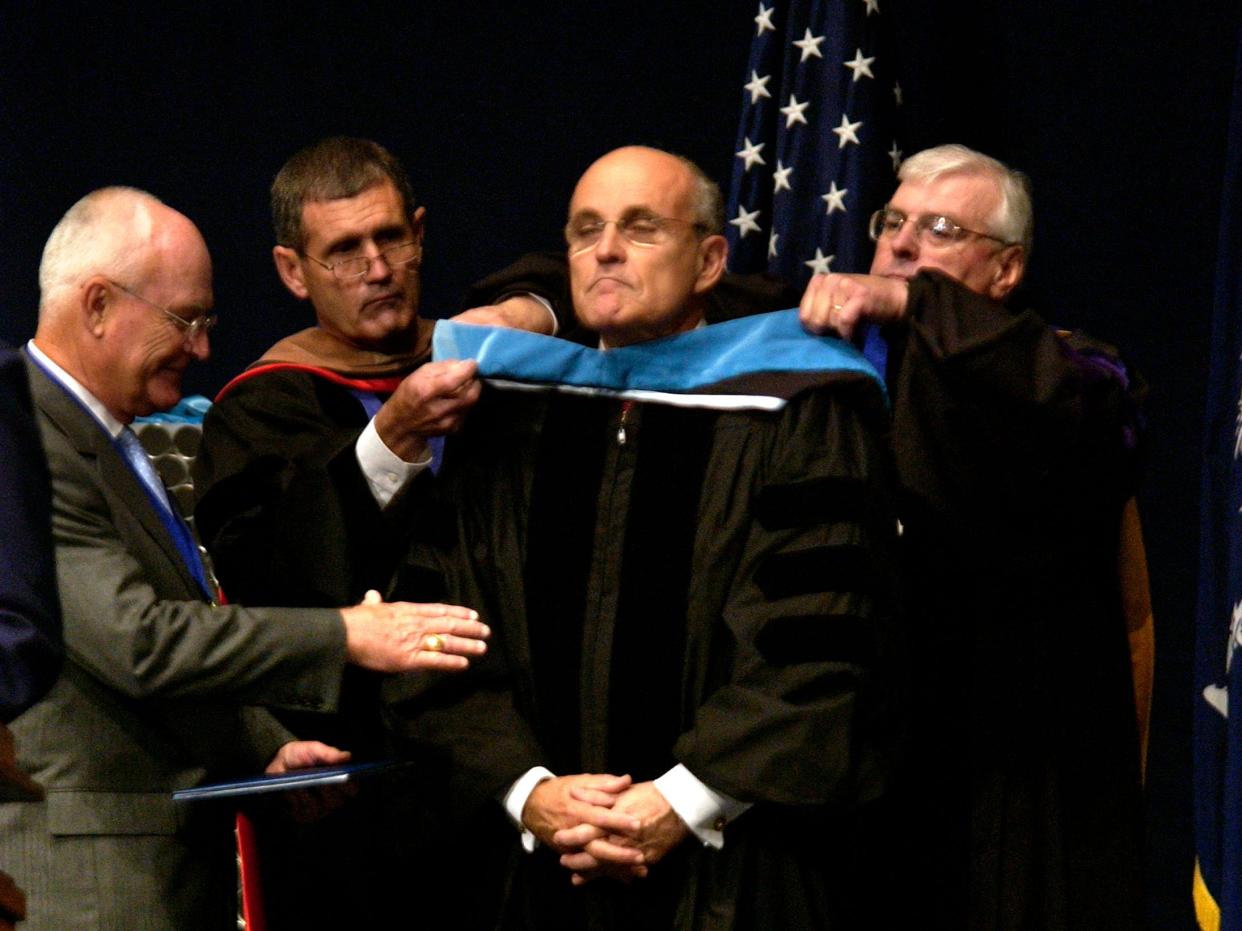 Republican presidential candidate Rudy Giuliani receives an honorary degree of Doctor of Public Administration during the graduation ceremony at the Citadel military college May 5, 2007 in Charleston, South Carolina.