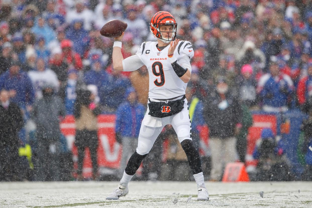 Cincinnati Bengals quarterback Joe Burrow (9) throws a pass during an NFL divisional round playoff football game Sunday, Jan. 22, 2023, in Orchard Park, NY. (AP Photo/Matt Durisko)