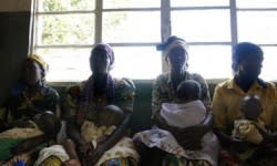 <b>Rwandan women wait for medical treatment at a clinic in Kibuye in 2005. During the Rwandan genocide in the early 1990s, an estimated 25,000 women were tortured through rape.</b> Jose Cendon/AFP/<a class="link " href="http://www.gettyimages.com" rel="nofollow noopener" target="_blank" data-ylk="slk:Getty Images;elm:context_link;itc:0;sec:content-canvas">Getty Images</a>