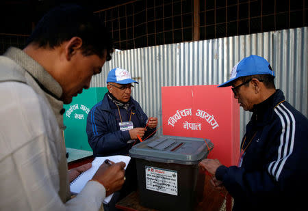 Officers from election commission seal a ballot box during the parliamentary and provincial elections at Chautara in Sindhupalchok District November 26, 2017. REUTERS/Navesh Chitrakar