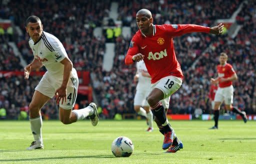 Manchester United midfielder Ashley Young (R) and Swansea City's Steven Caulker during their Premier League match against Swansea City on May 6. Four minutes before the break United had a second when Young's low strike beat Swansea goalkeeper Michel Vorm