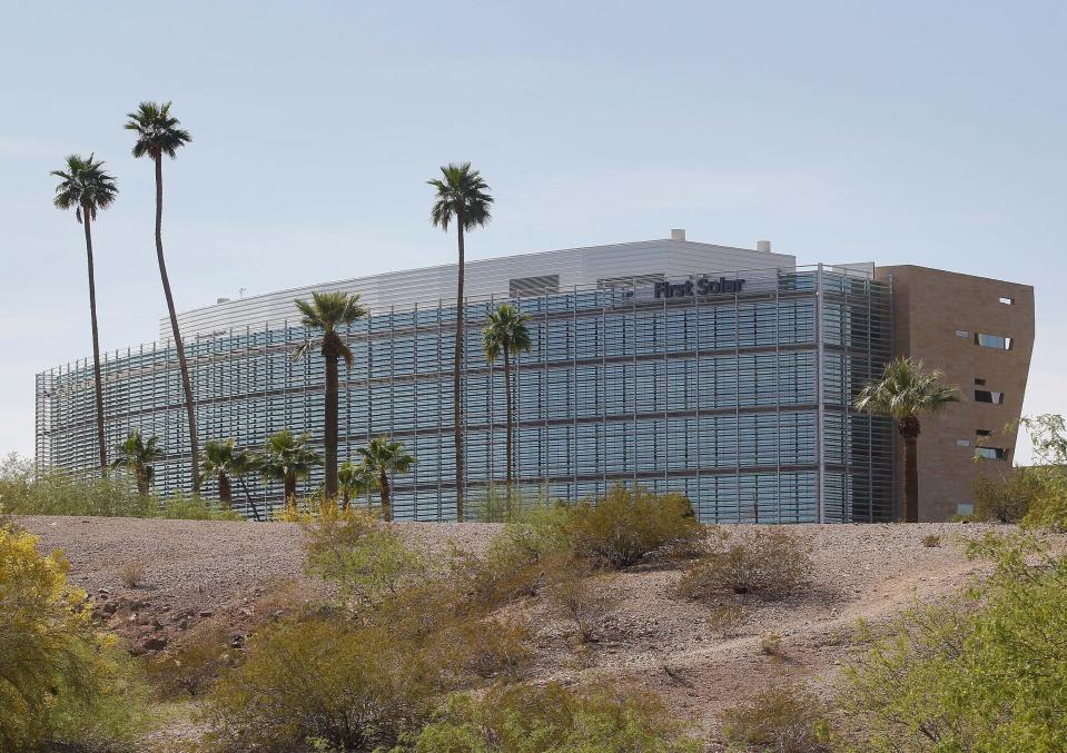 FILE - First Solar Inc's corporate headquarters are seen April 18, 2012, in Tempe, Ariz. One of President Joe Biden's signature laws aimed to invigorate renewable energy manufacturing in the U.S. It will also helped a solar panel company reap billions of dollars. Arizona-based First Solar is one of the biggest early winners from the Democrats' Inflation Reduction Act, offering a textbook case of how the inside influence game works in Washington. (AP Photo/Matt York)