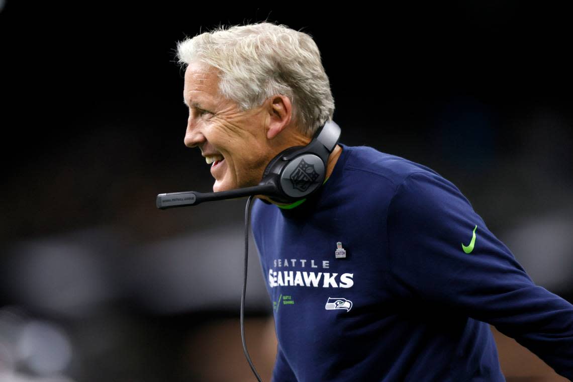 Seattle Seahawks head coach Pete Carroll celebrates Tariq Woolen’s interception during an NFL football game against the New Orleans Saints in New Orleans, Sunday, Oct. 9, 2022. (AP Photo/Derick Hingle)