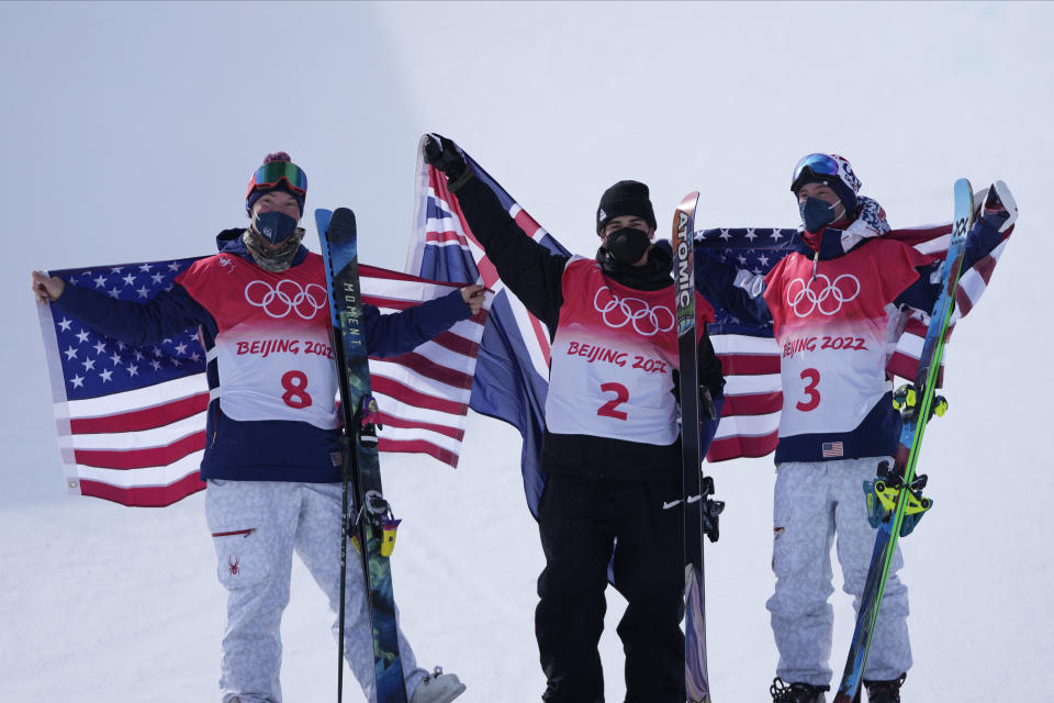 From left silver medal winner United States' David Wise, gold medal winner New Zealand's Nico Porteous and bronze medal winner United States's Alex Ferreira celebrate during the venue award ceremony for the men's halfpipe at the 2022 Winter Olympics, Saturday, Feb. 19, 2022, in Zhangjiakou, China. (AP Photo/Lee Jin-man)