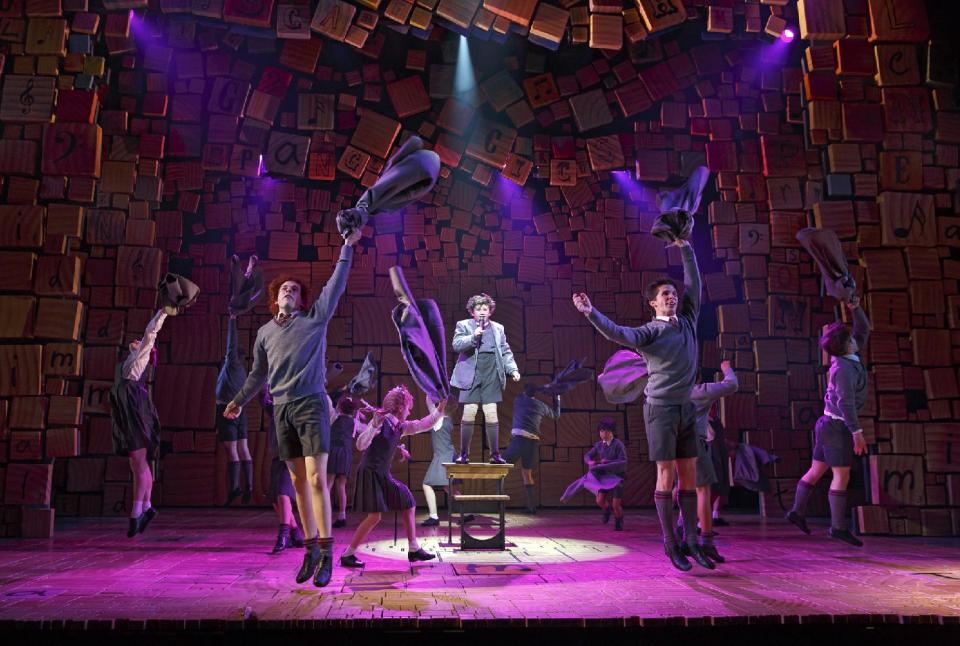 This theater publicity image released by Boneau/Bryan-Brown shows the cast of "Matilda The Musical," during a performance in New York. Great sets, choreography and songs make this British import hard to resist. Music and lyrics by Tim Minchin stick with you _ especially "Miracle," "Telly," "When I Grow Up" and "The Smell of Rebellion" _ and the whole show thrillingly reminds you of the darkness of being a kid. (AP Photo/Boneau/Bryan-Brown, Joan Marcus)