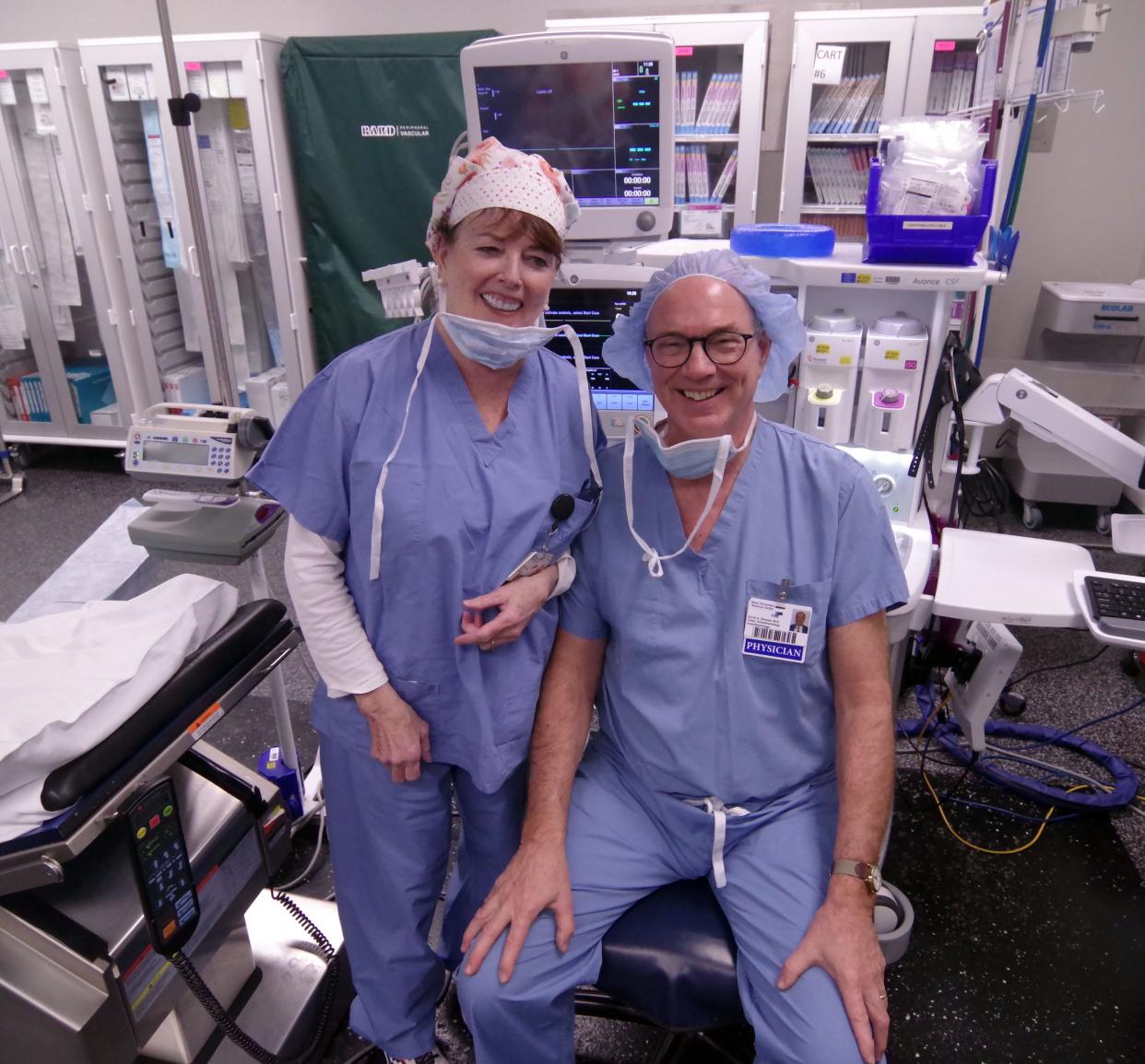 Longtime veteran nurse Elizabeth Brady and Dr. Scott Stewart, chairman of Anesthesiology at Good Samaritan Hospital, get set to receive their next patient in the operating room on Jan. 17, 2024. Brady and Stewart are retiring with a collective 70 years of experience.
