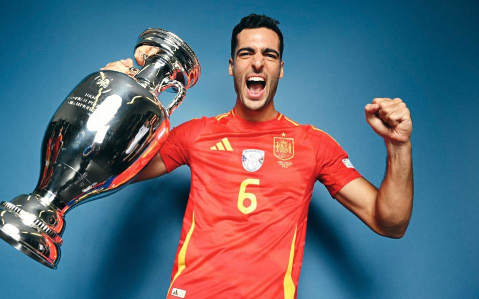 Mikel Merino of Spain poses for a photo with the UEFA Euro 2024 Henri Delaunay Trophy