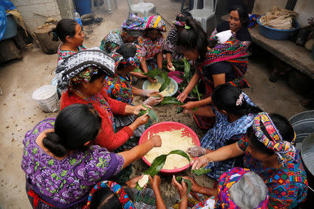 Women prepare tamales for the invitees to the house of the family of Claudia Gomez, a 19-year old Guatemalan immigrant who was shot by an U.S. Border Patrol officer, in San Juan Ostuncalco, Guatemala May 27, 2018. REUTERS/Luis Echeverria