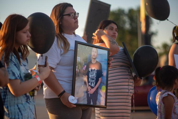 Family members and friends of Jacob James led a procession down 12th Street, after sharing memories of him at a vigil on Wednesday, August 10, 2022.