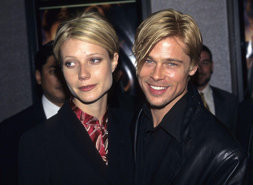 Closeup of Gwyneth Paltrow and Brad Pitt at an event with very similar short haircuts