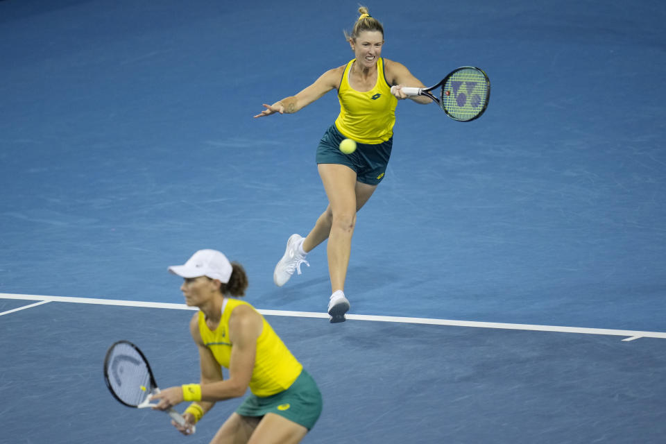 Storm Sanders, right, and Samantha Stosur of Australia return a ball during the semi-finals against Alicia Barnett and Olivia Nicholls of Great Britain, at the Billie Jean King Cup tennis finals at the Emirates Arena in Glasgow, Scotland, Saturday, Nov. 12, 2022. (AP Photo/Kin Cheung)