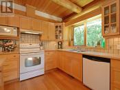 <p><span>8701 Griggs Terrace, North Saanich, B.C.</span><br> The kitchen offers ample space to prepare some memorable cottage meals.<br> (Photo: Zoocasa) </p>