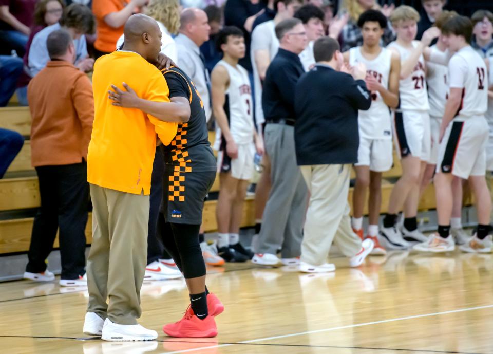 Peoria Quest Gators head coach Ron Ingram comforts player Terry Broadway after their 65-43 loss to Illini Bluffs in the Class 1A boys basketball regional semifinal Wednesday, Feb. 21, 2024 at Illini Bluffs High School in Glasford.