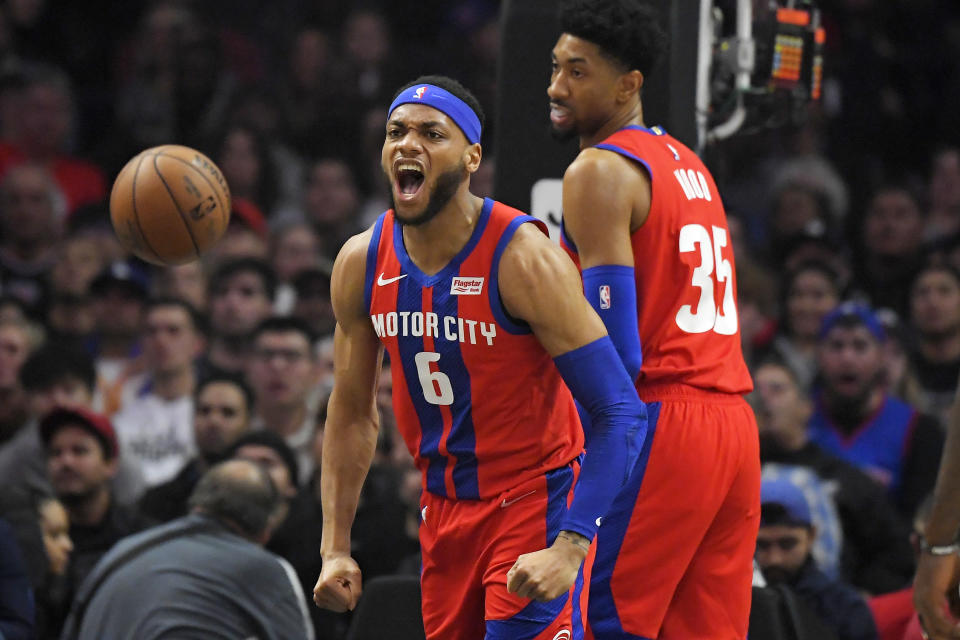 Detroit Pistons guard Bruce Brown, left, celebrates after scoring and drawing a foul as forward Christian Wood stands by during the first half of an NBA basketball game against the Los Angeles Clippers Thursday, Jan. 2, 2020, in Los Angeles. (AP Photo/Mark J. Terrill)