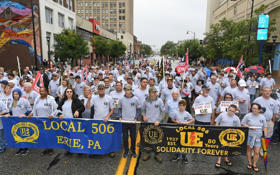 About 300 members and relatives of members of Local 506 of the United Electrical, Radio and Machine Workers march in a Labr Day parade in Erie in 2019. UE Local 506 represents most of the unionized workers at Wabtec Corp. in Lawrence Park Township