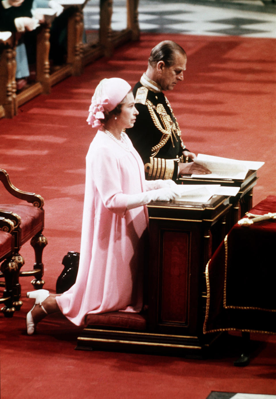 FILE - Britain's Queen Elizabeth II kneels with her husband Prince Philip, the Duke of Edingburgh, at St. Pauls's Cathedral, Parish Church of the City of London, during her Silver Jubilee celebrations, June 7, 1977. Queen Elizabeth II, Britain’s longest-reigning monarch and a rock of stability across much of a turbulent century, has died. She was 96. Buckingham Palace made the announcement in a statement on Thursday Sept. 8, 2022. (Pool via AP, File)