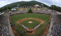 Honolulu, Hawaii, lines the first baseline and South Korea lines the third baseline as the teams are introduced before the Little League World Series Championship baseball game at Lamade Stadium in South Williamsport, Pa., Sunday, Aug. 26, 2018. (AP Photo/Gene J. Puskar).