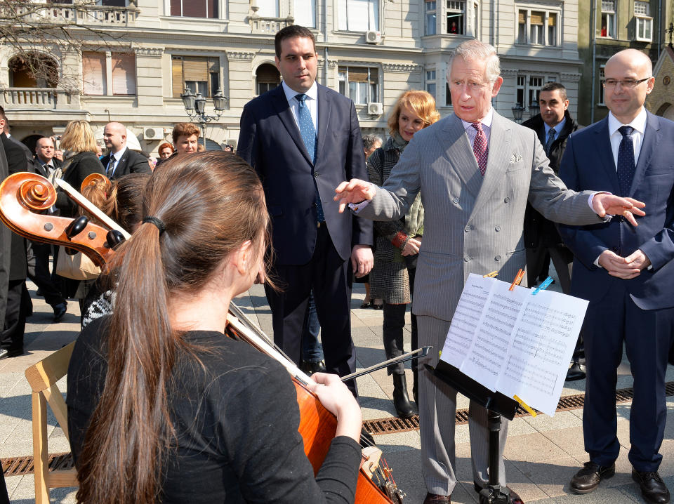 NOVI SAD, SERBIA - MARCH 17:  Prince Charles, Prince of Wales and Camilla, Duchess of Cornwall (not pictured) listen to a chamber orchestra perform on a market square during a visit to Novi Sad on the second day of a two day visit to Serbia on March 17, 2016 in Novi Sad, Serbia. The Prince Charles, Prince of Wales and Camilla, Duchess of Cornwall are currently on a 6 day tour of the Balkans. (Photo by John Stillwell - Pool/Getty Images)