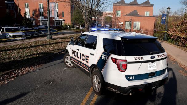 PHOTO: A law enforcement blocks access to the crime scene where there was a shooting on the grounds of the University of Virginia, Nov. 14, 2022 in Charlottesville. (Win Mcnamee/Getty Images)