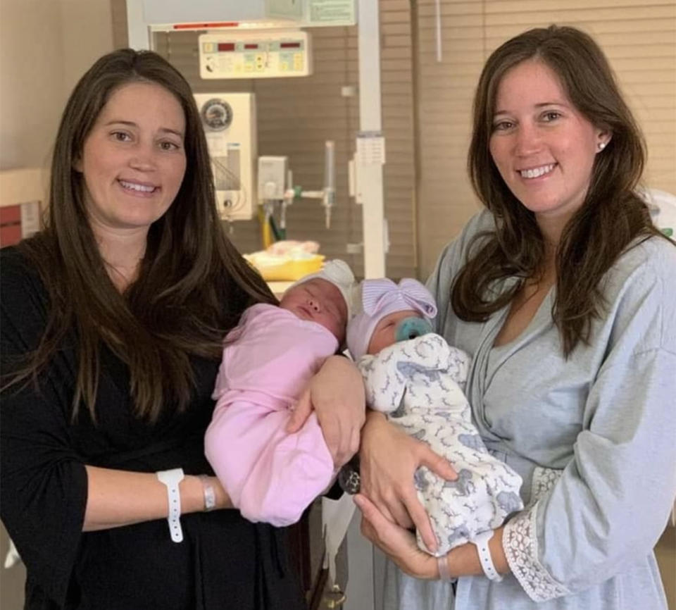 Autum Shaw cradled her daughter, Charleston, while Autum's twin sister Amber Tramontana posed with her daughter, Blakely. (Courtesy Amber Tramontana)