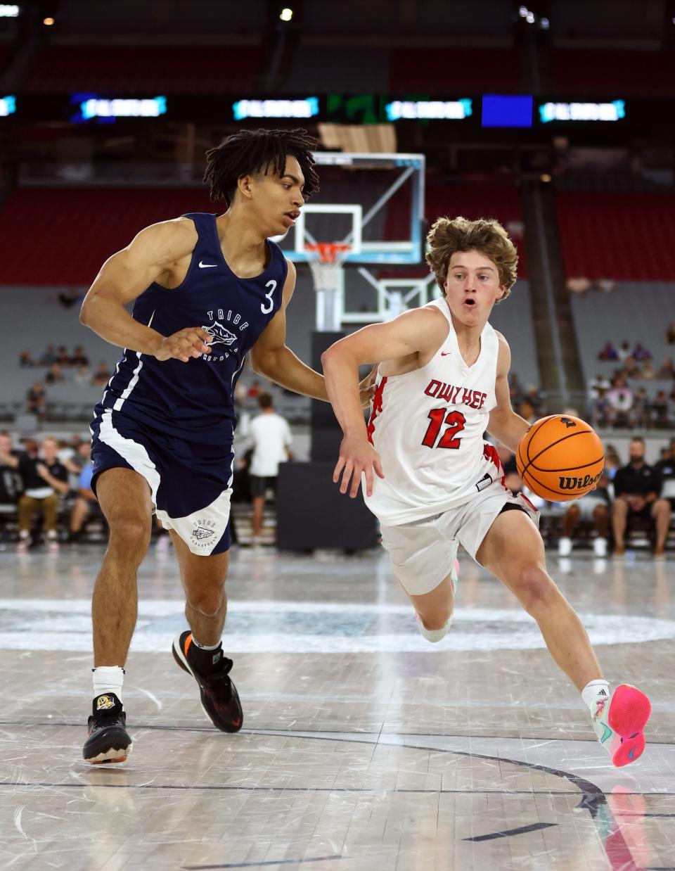 Jun 23, 2023; Glendale, AZ, USA; Owyhee player Logan Haustveit (12) against St John Bosco player Elzie Harrington (3) during the Section 7 high school boys tournament at State Farm Stadium. Mandatory Credit: Mark J. Rebilas-USA TODAY Sports