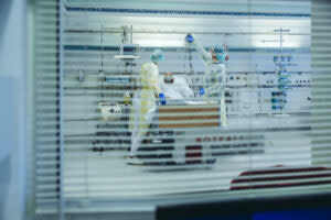 health care workers treat a patient