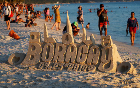 A sand sculpture is seen along the beach, a day before the temporary closure of the holiday island Boracay, in the Philippines April 25, 2018. REUTERS/Erik De Castro