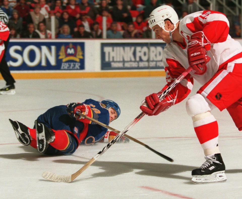 Detroit Red Wings' Steve Yzerman fools St. Louis Blues' Ricard Persson during Game 5 of the first round playoff series at Joe Louis Arena, April 25, 1997.