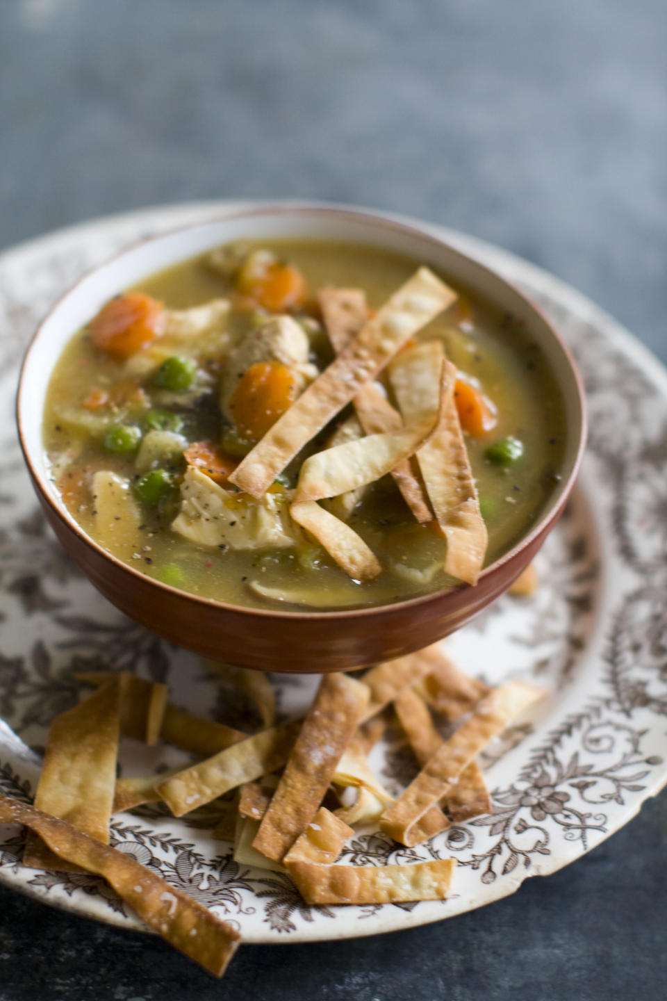 This Dec. 2, 2013 photo shows Chinese chicken and vegetable soup in Concord, N.H. This recipe's fragrant broth is essentially a Chinese version of a Jewish chicken soup. (AP Photo/Matthew Mead)