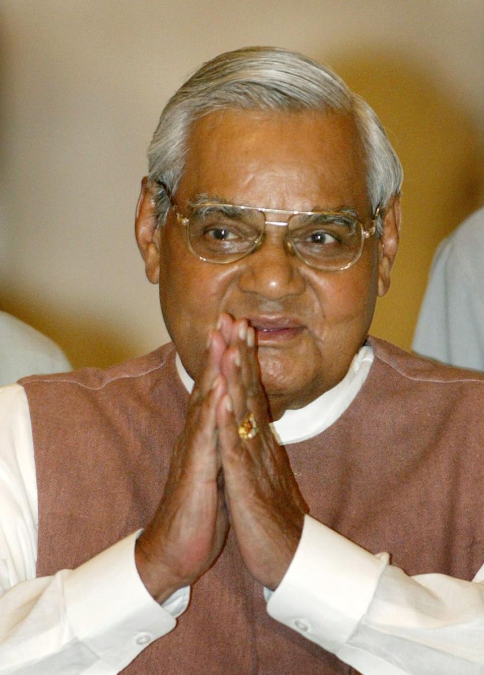 FILE - In this May 2, 2004 file photo, Indian Prime Minister Atal Bihari Vajpayee greets the audience as he arrives for a ceremony at the Presidential Palace in New Delhi, India. Former prime minister Vajpayee, who pursued both nuclear weapons and peace talks with Pakistan, died Thursday, Aug. 16, 2018, at age 93. (AP Photo/Gurinder Osan)