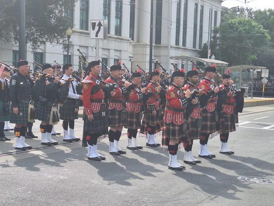 Pipers ready to begin at Joshua Eyer processional, May 3, 2024 outside CMPD headquarters.