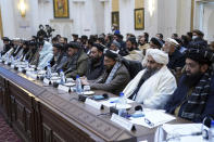 Taliban officials listen as Taliban Prime Minister Mohammad Hasan Akhund speaks during an economic conference at the former Presidential Palace in Kabul, Afghanistan, Wednesday, Jan. 19, 2022. Afghanistan's Taliban rulers are holding their first economic conference, five months since taking over the country that is now teetering on the verge of a humanitarian catastrophe and economic collapse. The U.N. head of mission for Afghanistan said at the gathering on Wednesday that surprising $1 billion in exports. (Taliban Prime Minister Media Office via AP)