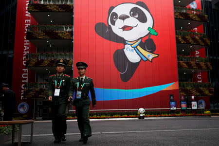 Security guards keep watch at the National Exhibition and Convention Center, the venue for the upcoming China International Import Expo (CIIE), in Shanghai, China November 3, 2018. REUTERS/Aly Song