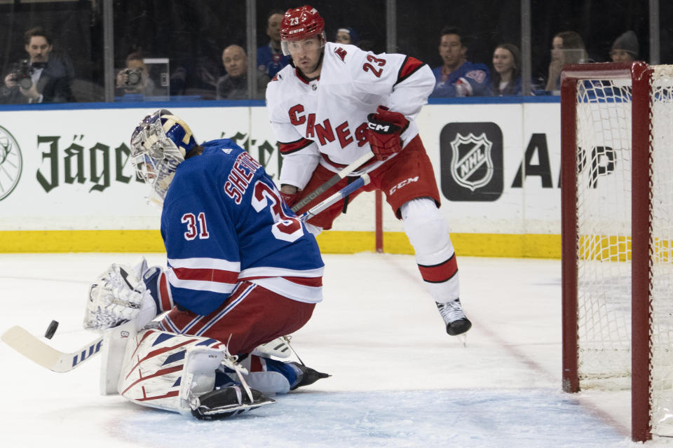 New York Rangers goaltender Igor Shesterkin (31) makes a save against Carolina Hurricanes right wing Stefan Noesen (23) during the first period of an NHL hockey game Tuesday, March 21, 2023, at Madison Square Garden in New York. (AP Photo/Mary Altaffer)