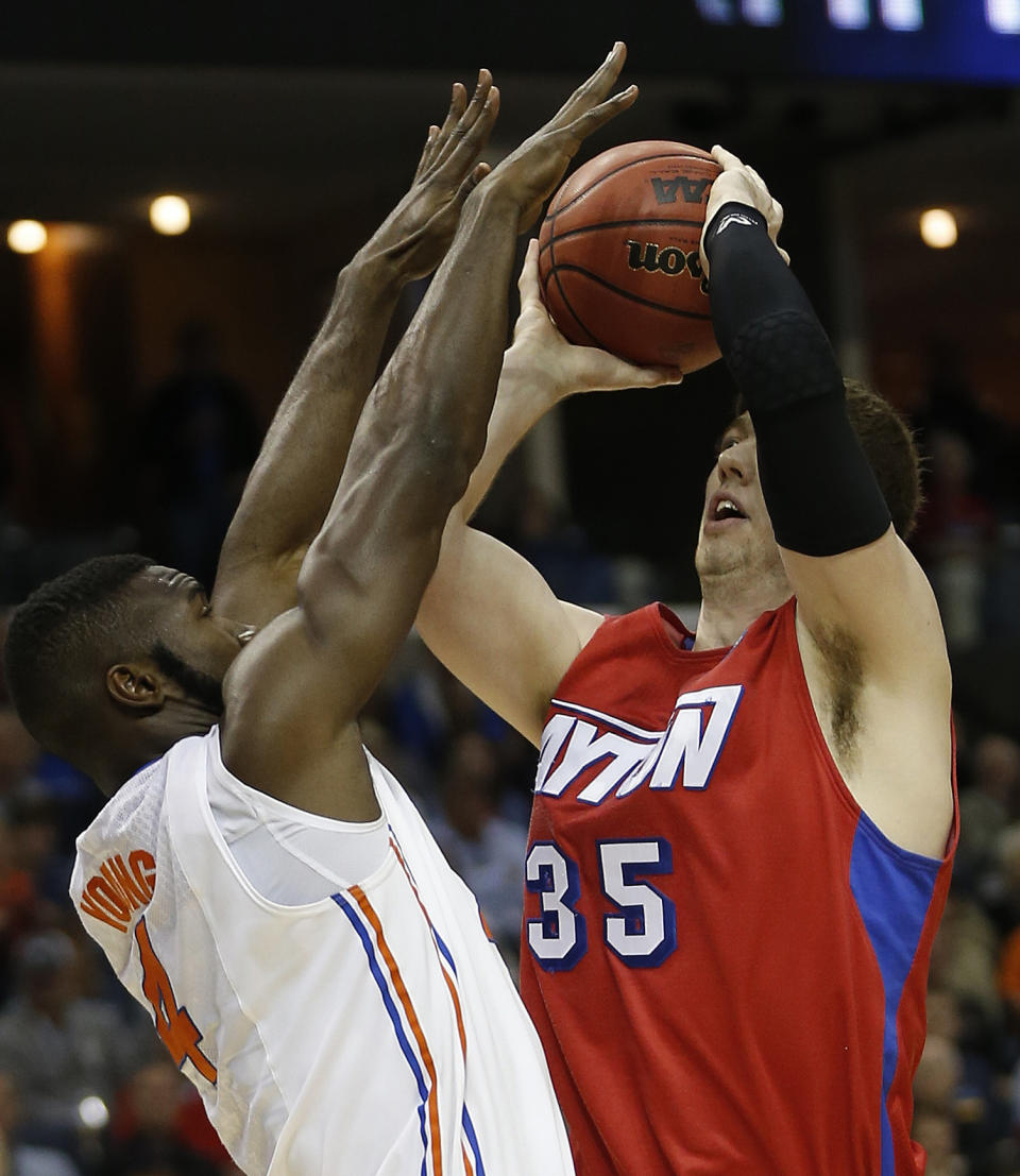 Dayton forward/center Matt Kavanaugh (35) shoots against Florida center Patric Young (4) during the first half in a regional final game at the NCAA college basketball tournament, Saturday, March 29, 2014, in Memphis, Tenn. (AP Photo/John Bazemore)