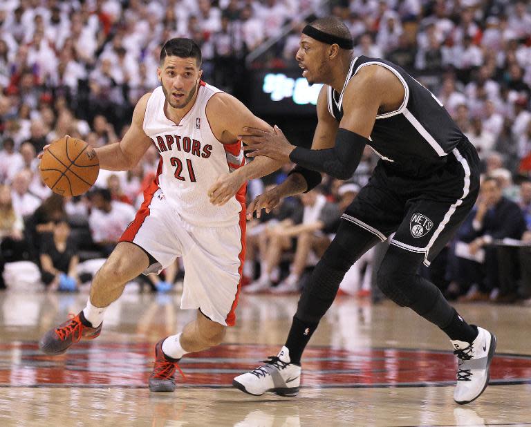 Paul Pierce of the Brooklyn Nets pushes past Greivis Vasquez of the Toronto Raptors in Game One of the NBA Eastern Conference play-off at the Air Canada Centre on April 19, 2014 in Toronto, Ontario, Canada which the Nets won 94-87