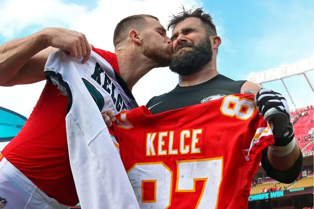 <p>Jay Biggerstaff-USA TODAY Sports</p> Kansas City Chiefs tight end Travis Kelce (87) kisses Philadelphia Eagles center Jason Kelce (62) after the game at Arrowhead Stadium