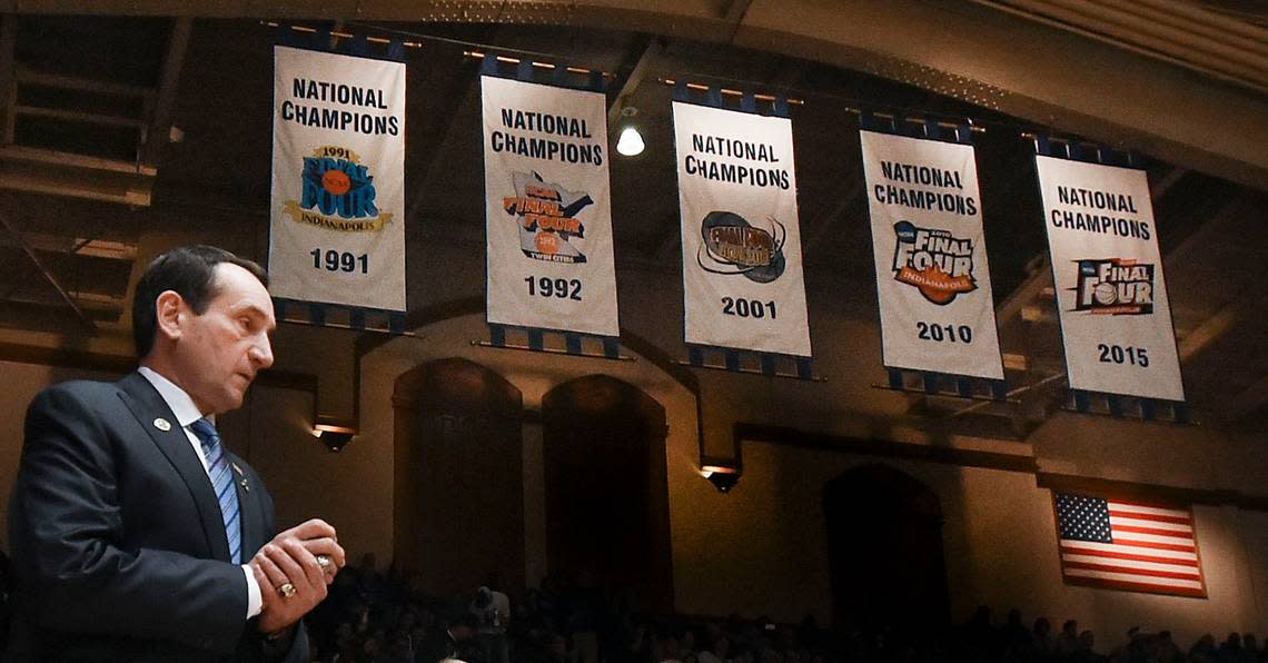 Duke head coach Mike Krzyzewski walks out to the court with the Blue Devils’ National Championship banners in the background in 2015.
