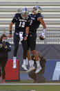 Nevada quarterback Carson Strong (12) celebrates with wide receiver Cole Turner after a touchdown pass against San Diego State during an NCAA college football game Saturday, Nov. 21, 2020, in Reno, Nev. (AP Photo/Lance Iversen)