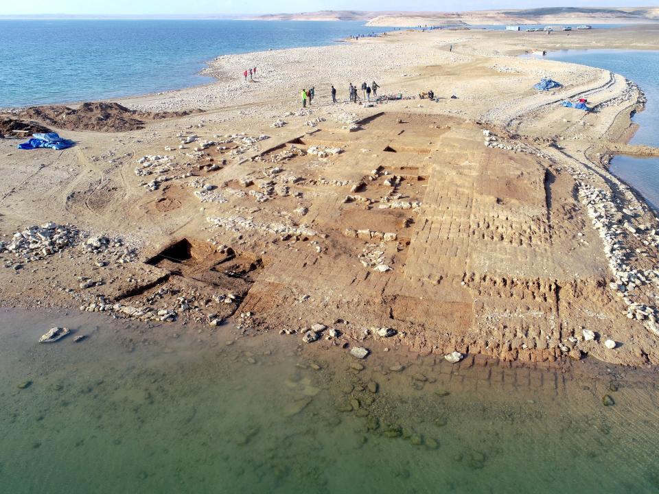 Aerial view of the excavations at Kemune with Bronze Age architecture partly submerged.