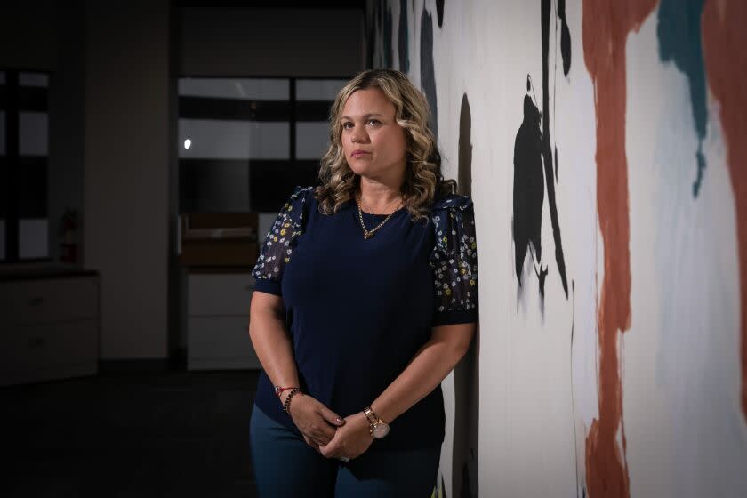 Manhattan Beach, CA - April 11: Michelle Blandin poses for a portrait at the law offices of Taylor & Ring on Tuesday, April 11, 2023 in Manhattan Beach, CA. Michelle Blandin parents and sister were victims of a triple homicide in Riverside that authorities say began with a "catfishing" case involving Blandin's niece. (Jason Armond / Los Angeles Times)