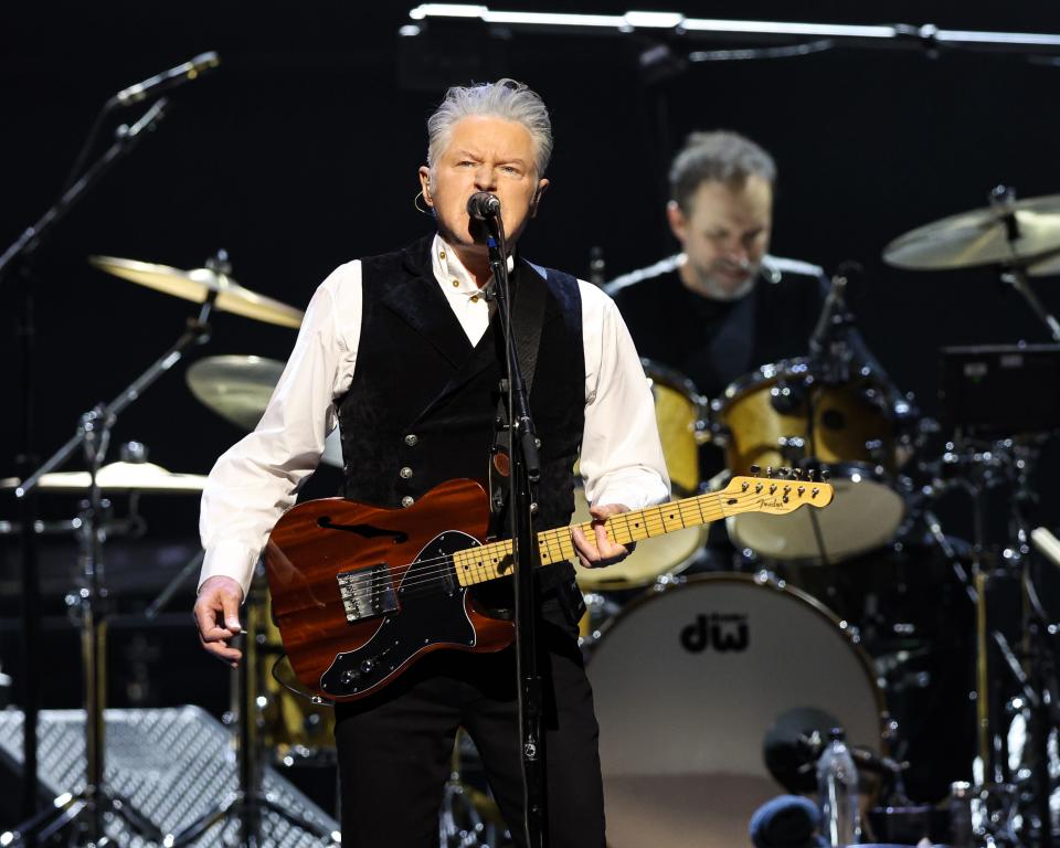 Don Henley of The Eagles plays guitar and sings lead vocals at Wells Fargo Arena on Thursday night in Des Moines.