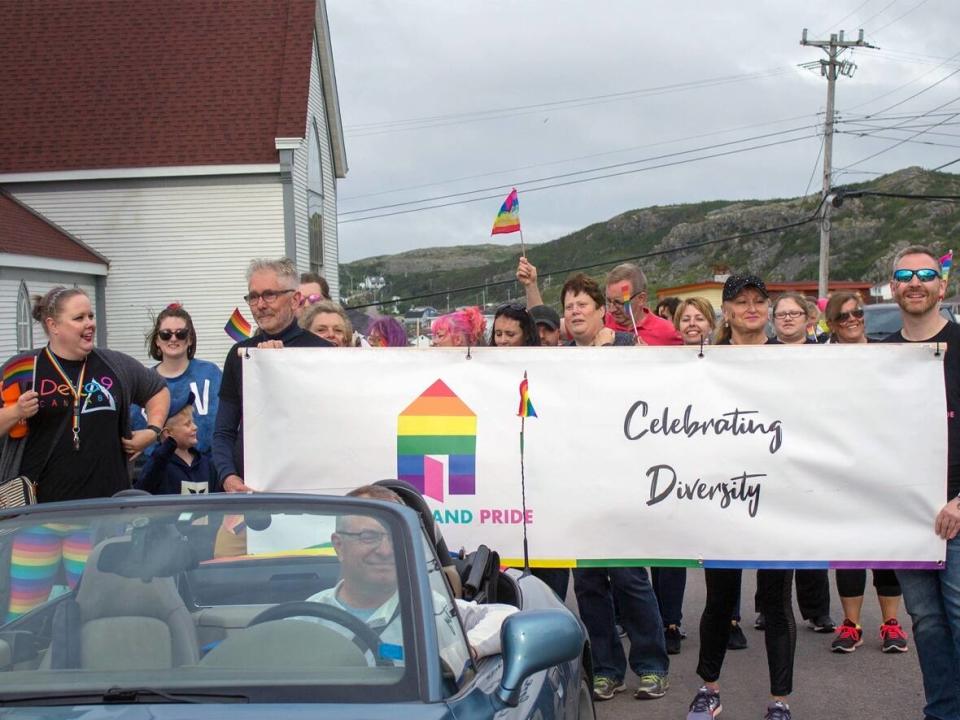 Trevor Taylor, far right, says it's important for both companies and consumers to make sure conversations and messaging during Pride Month are followed up with real world action. (Submitted by Fogo Island Pride - image credit)