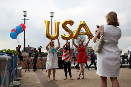 Attendees hold up balloons spelling U.S.A at a Republicans Overseas event in London, Britain, July 4, 2018. REUTERS/Simon Dawson