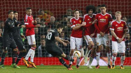 Football Soccer - Manchester United v Liverpool - UEFA Europa League Round of 16 Second Leg - Old Trafford, Manchester, England - 17/3/16. Liverpool's Philippe Coutinho shoots from a free kick. Action Images via Reuters / Jason Cairnduff