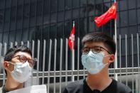 Pro-democracy activists Nathan Law and Joshua Wong speak to the media in response to the national security legislation in Hong Kong