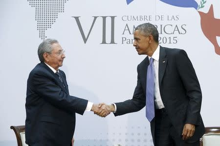 U.S. President Barack Obama (R) shakes hands with Cuba's President Raul Castro as they hold a bilateral meeting during the Summit of the Americas in Panama City, Panama, in this file photo taken April 11, 2015. REUTERS/Jonathan Ernst/Files