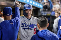 Los Angeles Dodgers' Corey Seager (5) celebrates in the dugout after hitting a solo home run against the San Francisco Giants during the ninth inning of a baseball game in San Francisco, Saturday, Sept. 4, 2021. (AP Photo/John Hefti)